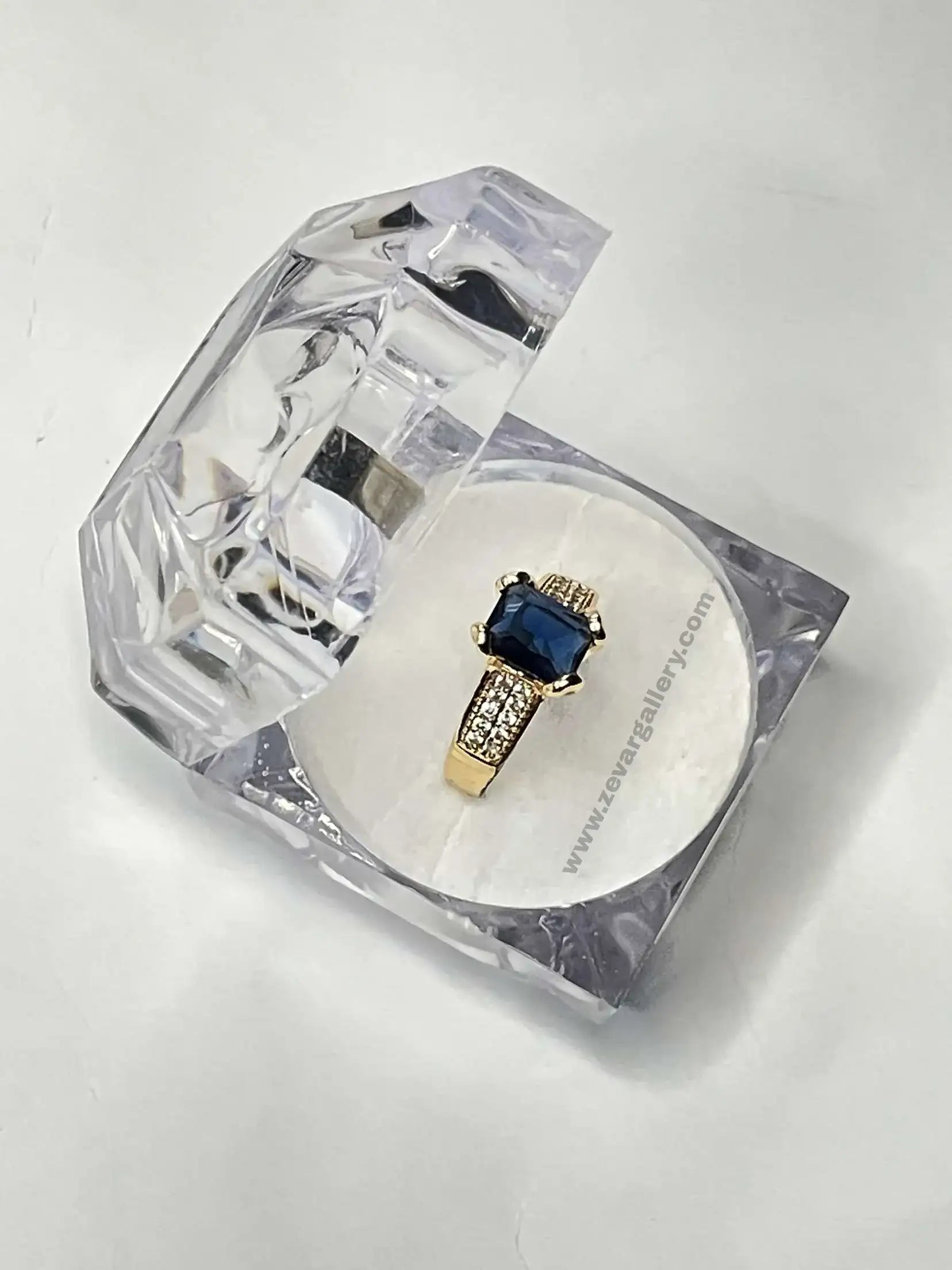 Vintage gold-plated adjustable ring with a square sapphire-blue gemstone and sparkling side accents – elegant statement jewelry for women by zevar gallery