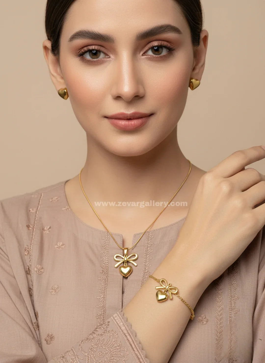 Zevar Gallery stainless steel bow and heart jewellery set with necklace, bracelet and earrings for women