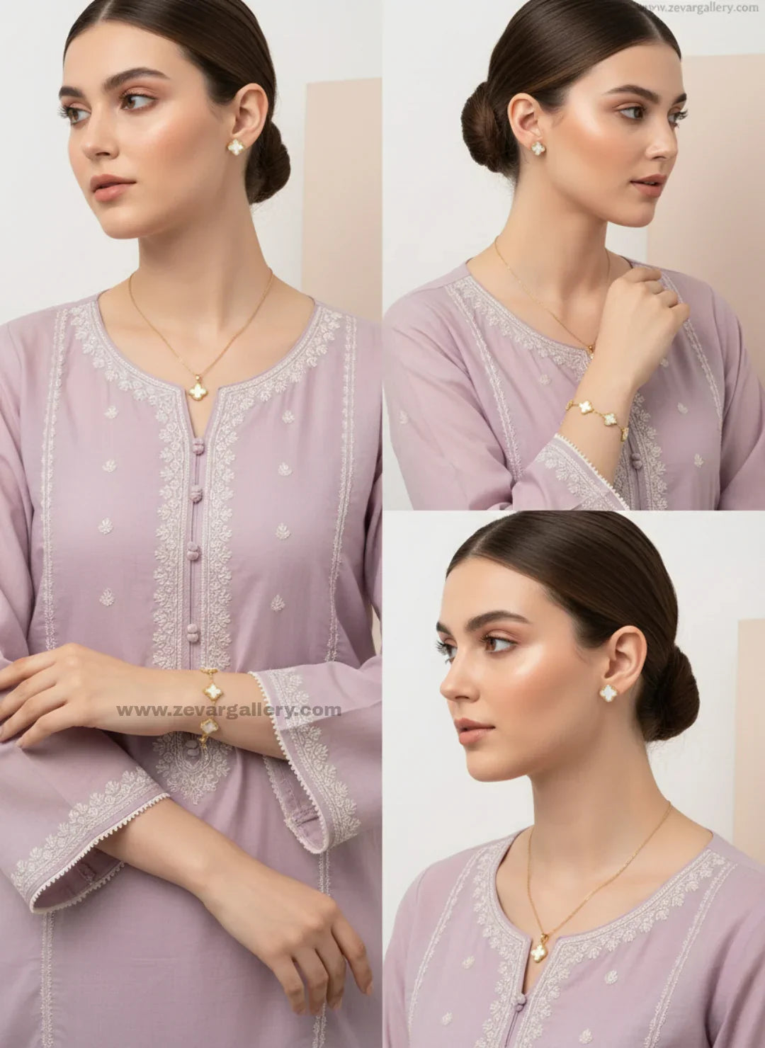 Stainless steel clover jewellery set with necklace, bracelet, and earrings featuring white clover motifs – Zevar Gallery